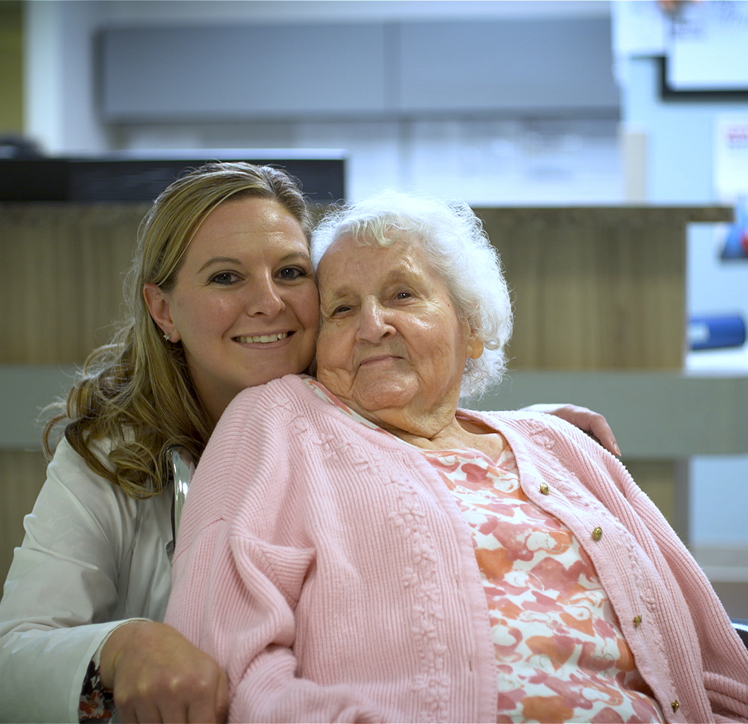 Employee walks with a Female Elderly Patient